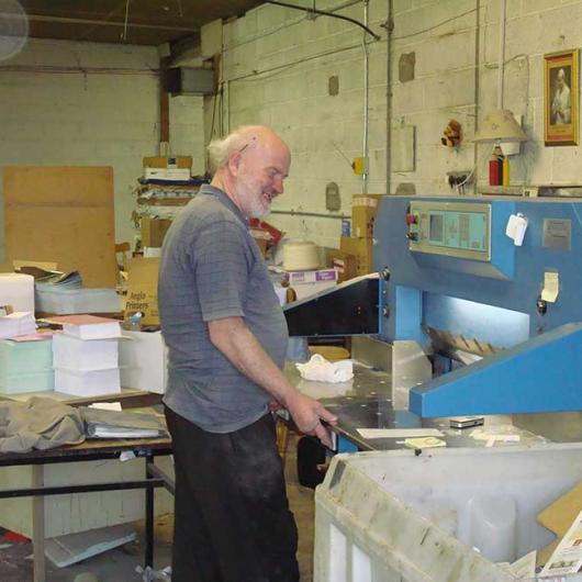 Damian Callan completes last cut on Guillotine in old Bindery, 2007
